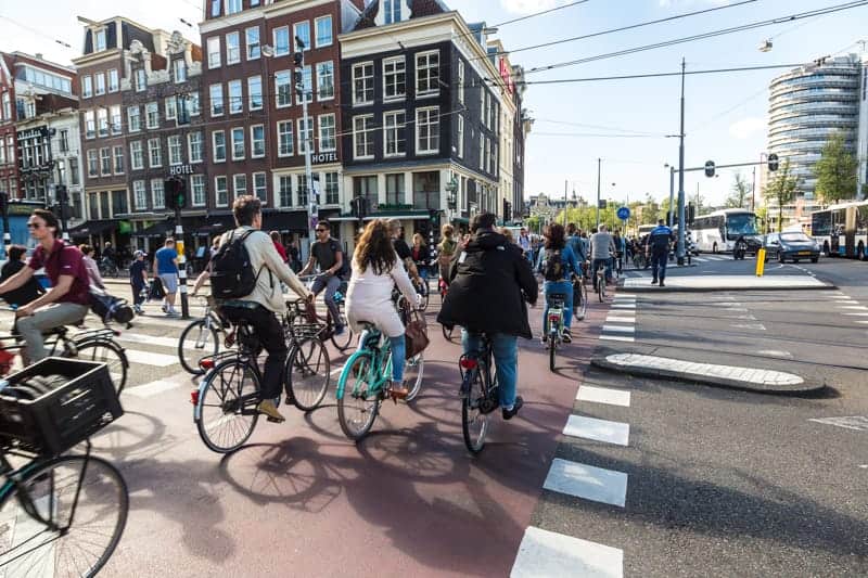 demographics Amsterdam. People riding on bikes.