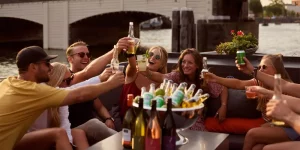 A group of people toasting on the BBQ boat in Amsterdam