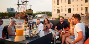 Group of people chatting on boat Amsterdam