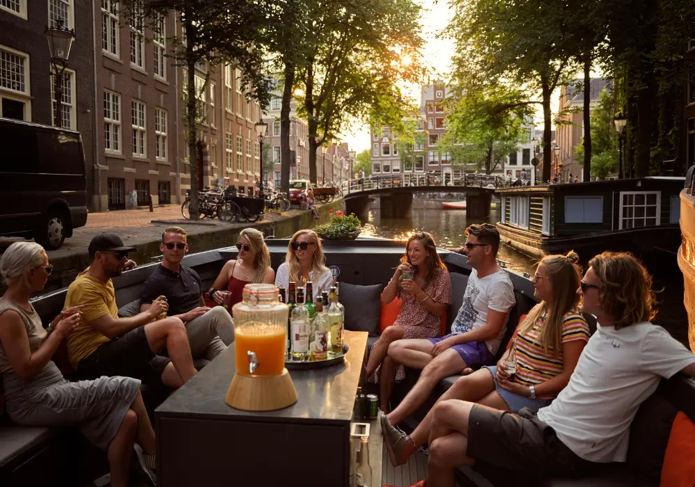 Group of people on a sloop on the Amsterdam canals