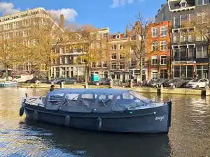Boat Amigo with canopy in autumn on canals