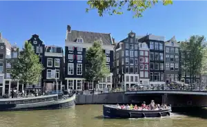Boat sloop Amigo on Amsterdam water