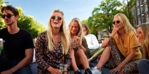 Laughing group of people on a boat in Amsterdam