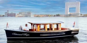 The Admiraal Heijn saloon boat sailing on the IJ in Amsterdam