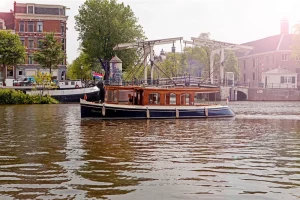 The Elisabeth saloon boat sailing through the canals of Amsterdam