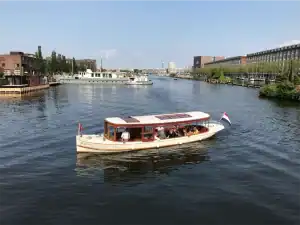 The Griffioen saloon boat sailing along Amsterdam’s canals