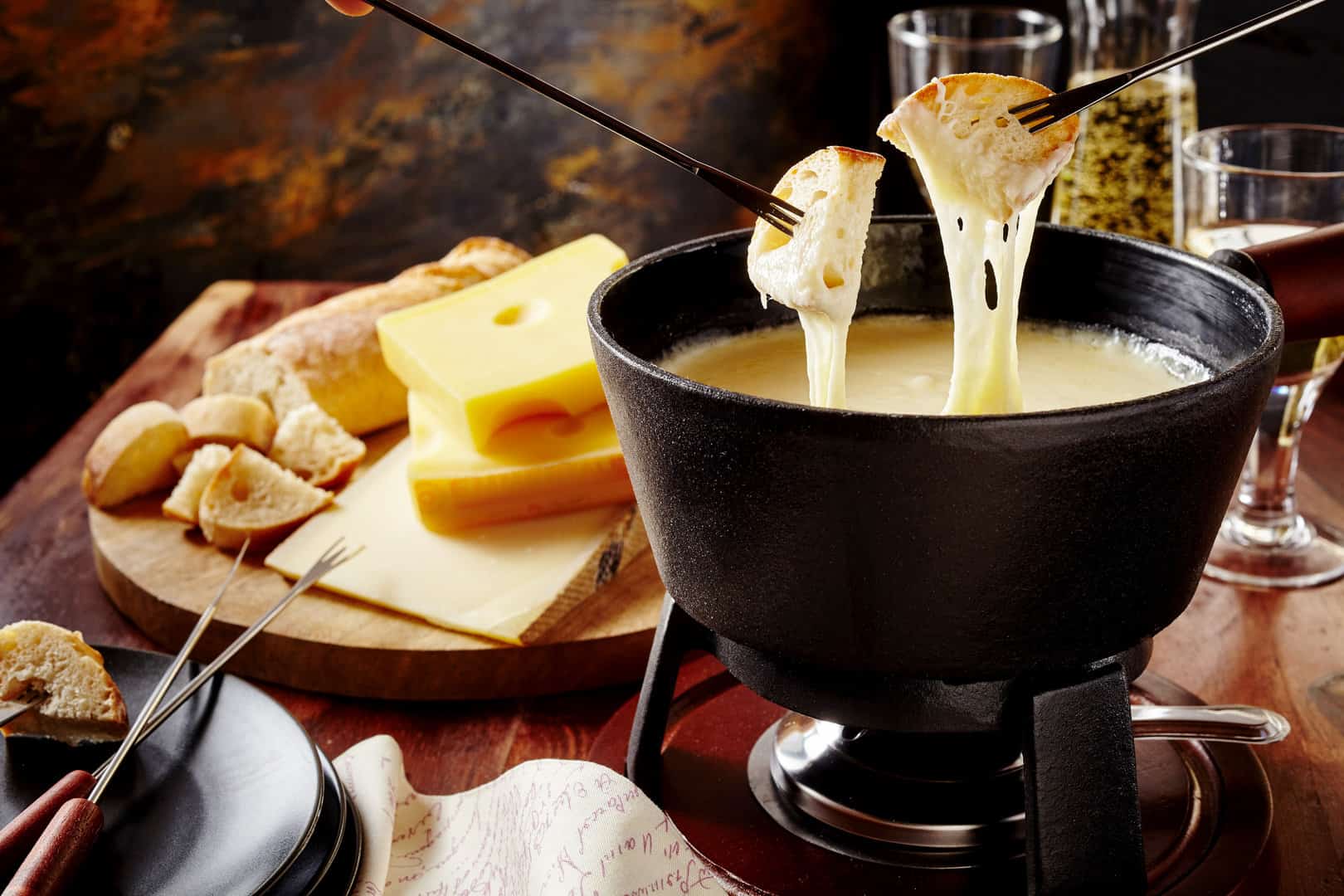 Bread is dipped in a cheese fondue